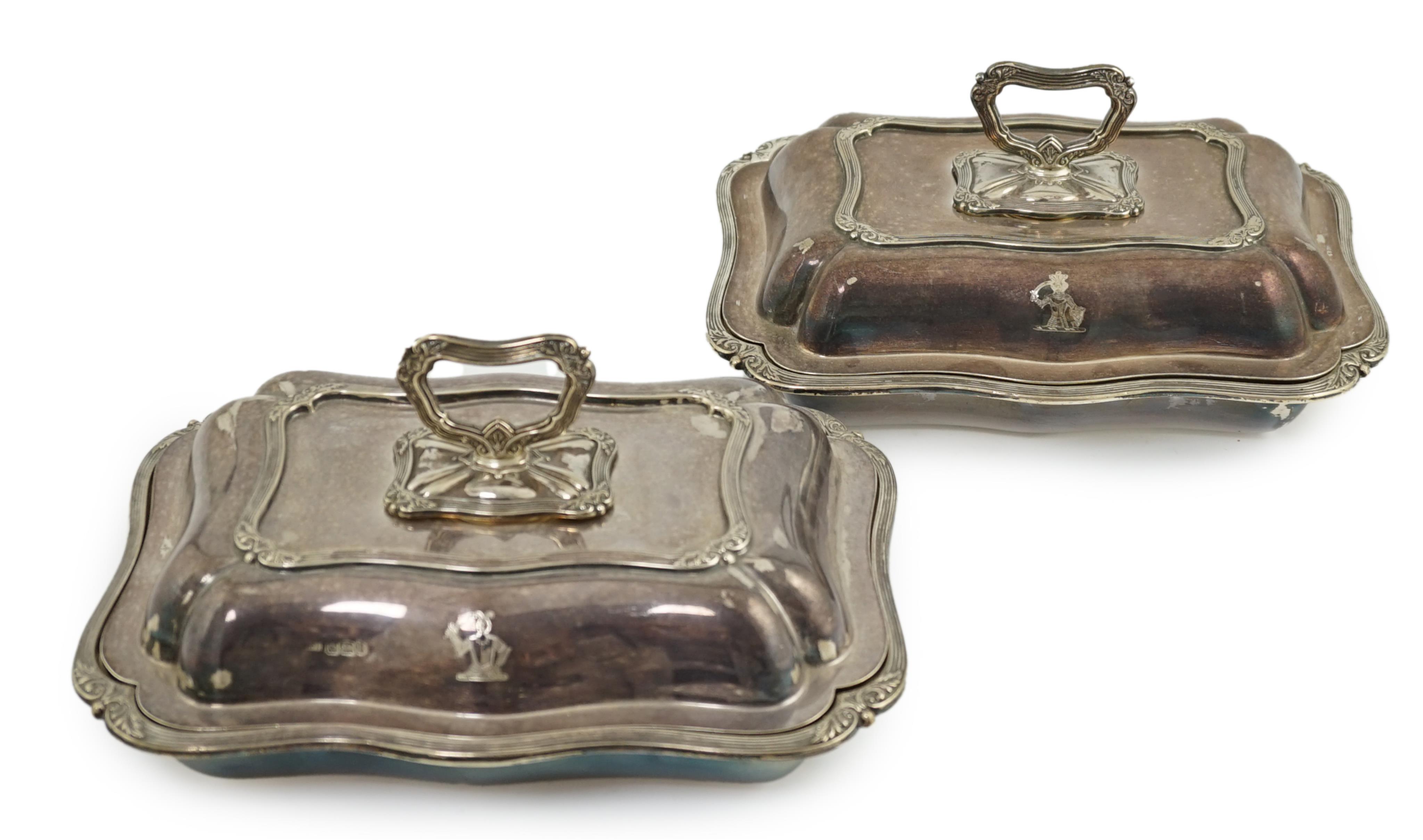 A pair of late Victorian silver entreé dishes and covers, with handles, by Harrison Brothers